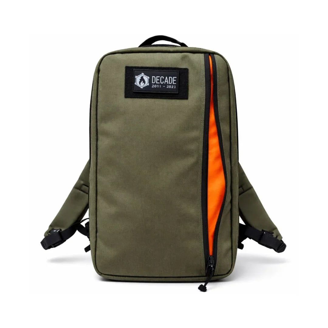 Recycled Firefighter 24 Hour Backpack in olive green with a round logo patch, orange zipper edge and shoulder straps
