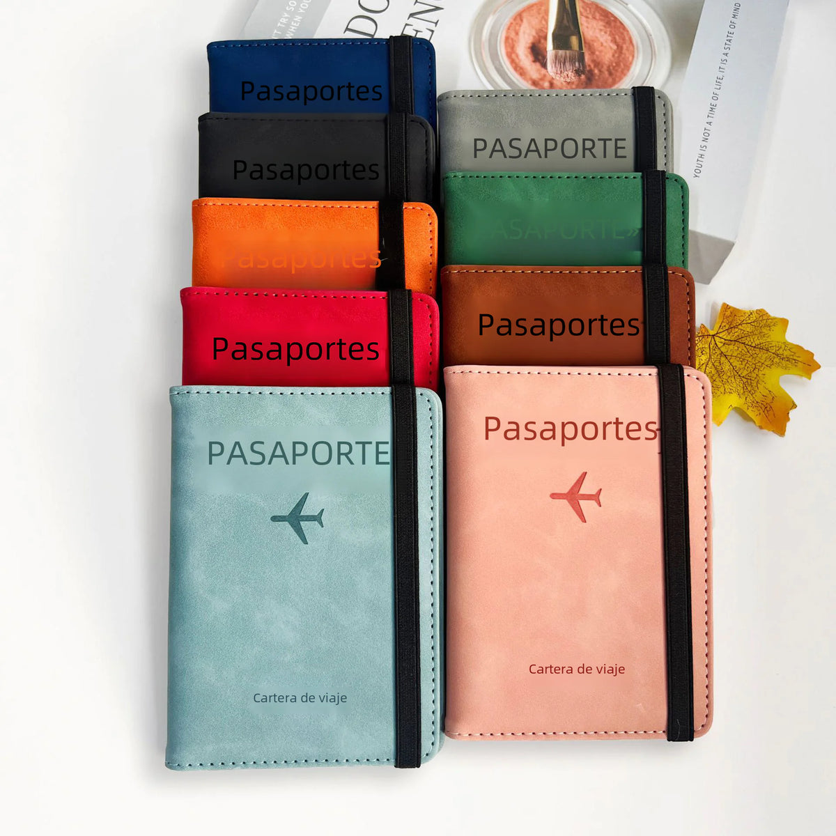 Passport holders lined up in several colors including black, orange, red and teal