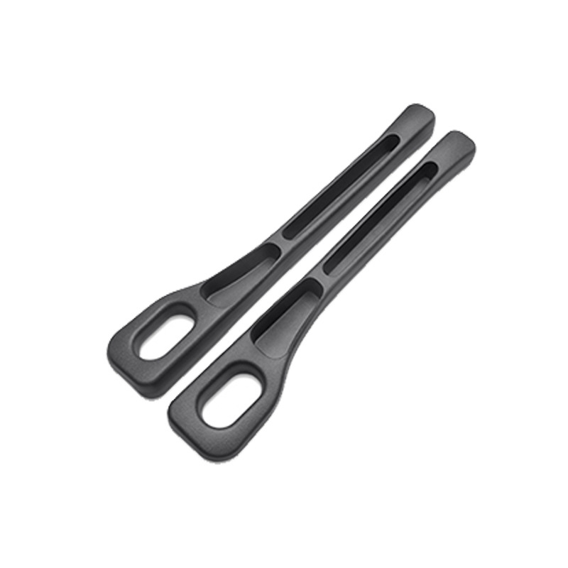 Pair of black CHICAMOR SeatSlot car seat gap fillers on a white background