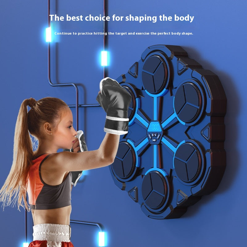 Girl with a ponytail wearing boxing gloves beside the wall-mounted boxing machine