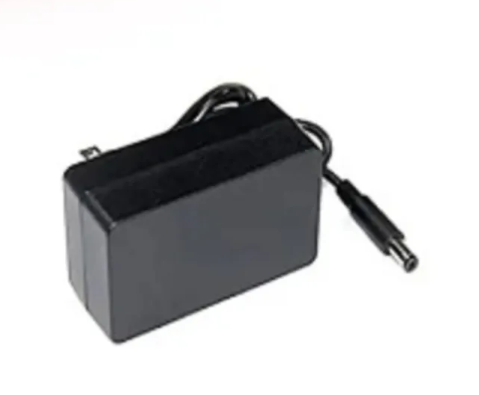Black power adapter with a coiled cable