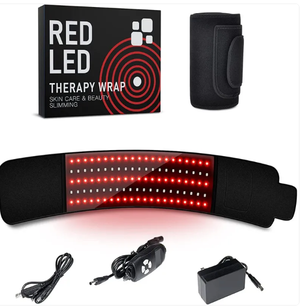 Red LED therapy wrap box and belt with glowing LEDs, beside its cable, controller and power adapter