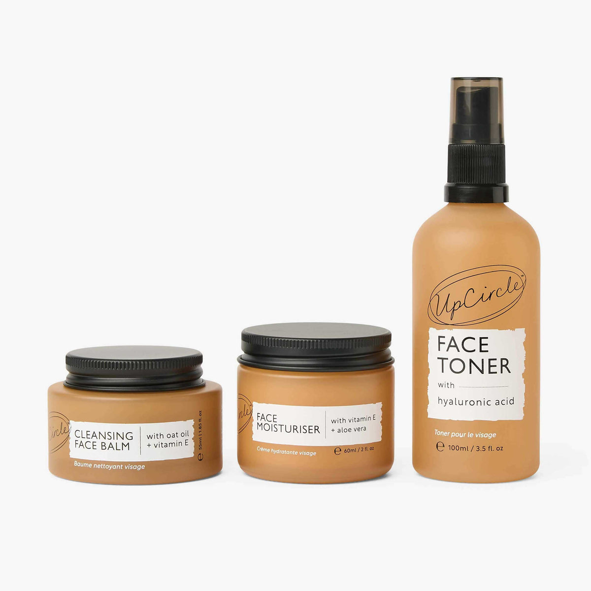 UpCircle face toner bottle beside the cleansing balm and moisturizer jars