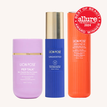 Three Lion Pose products: a lilac jar, a blue bottle and an orange bottle, with an Allure award badge