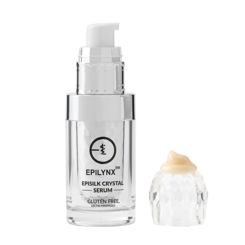 EpiLynx crystal brightening serum in a silver pump bottle beside a clear crystal-style cap