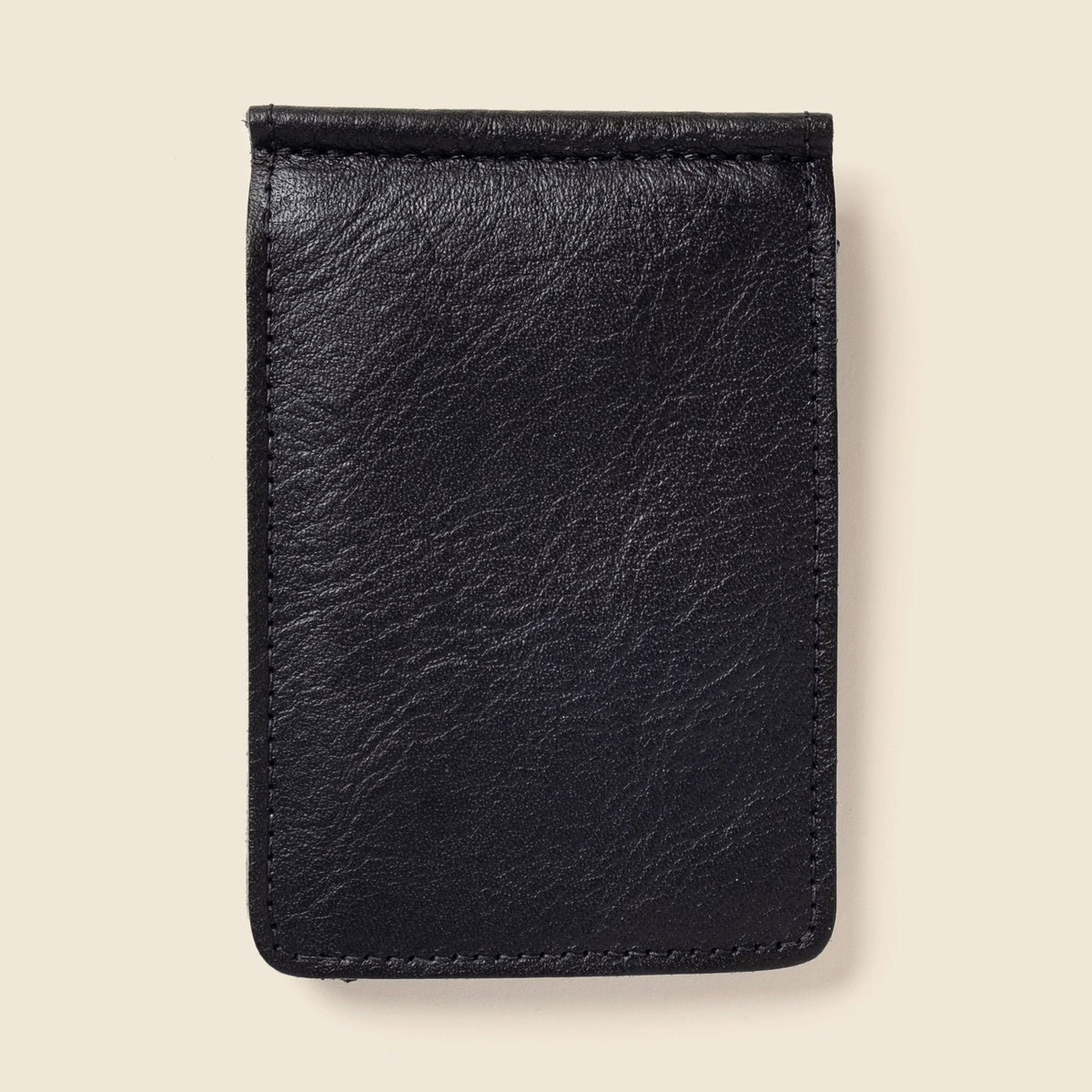 Black leather CASUPO money clip wallet, closed, seen from the back