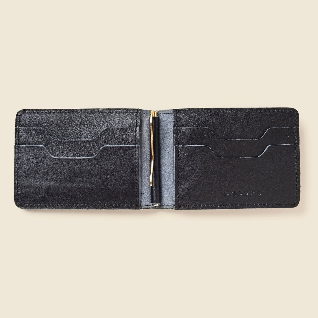 CASUPO bifold money clip wallet in black leather, open flat showing card slots and a gold clip