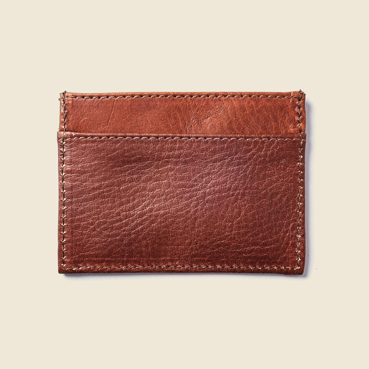 Back of the CASUPO chocolate brown leather card holder with two stitched pockets