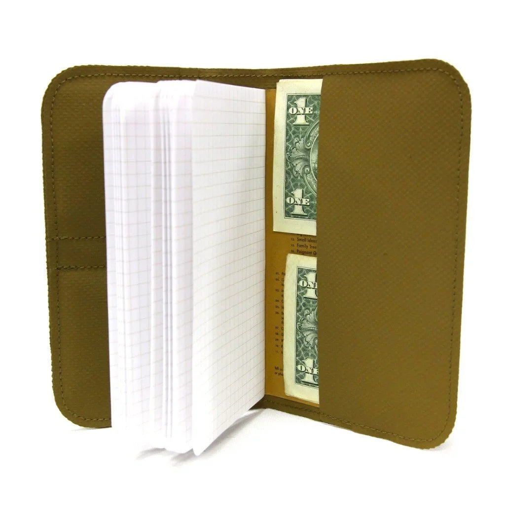 Open coyote Field Notes Wallet holding a notebook and two bills in the side pockets