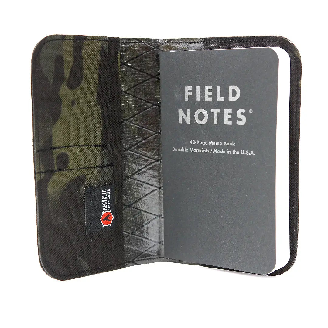Open black multicam Field Notes Wallet holding a Field Notes notebook