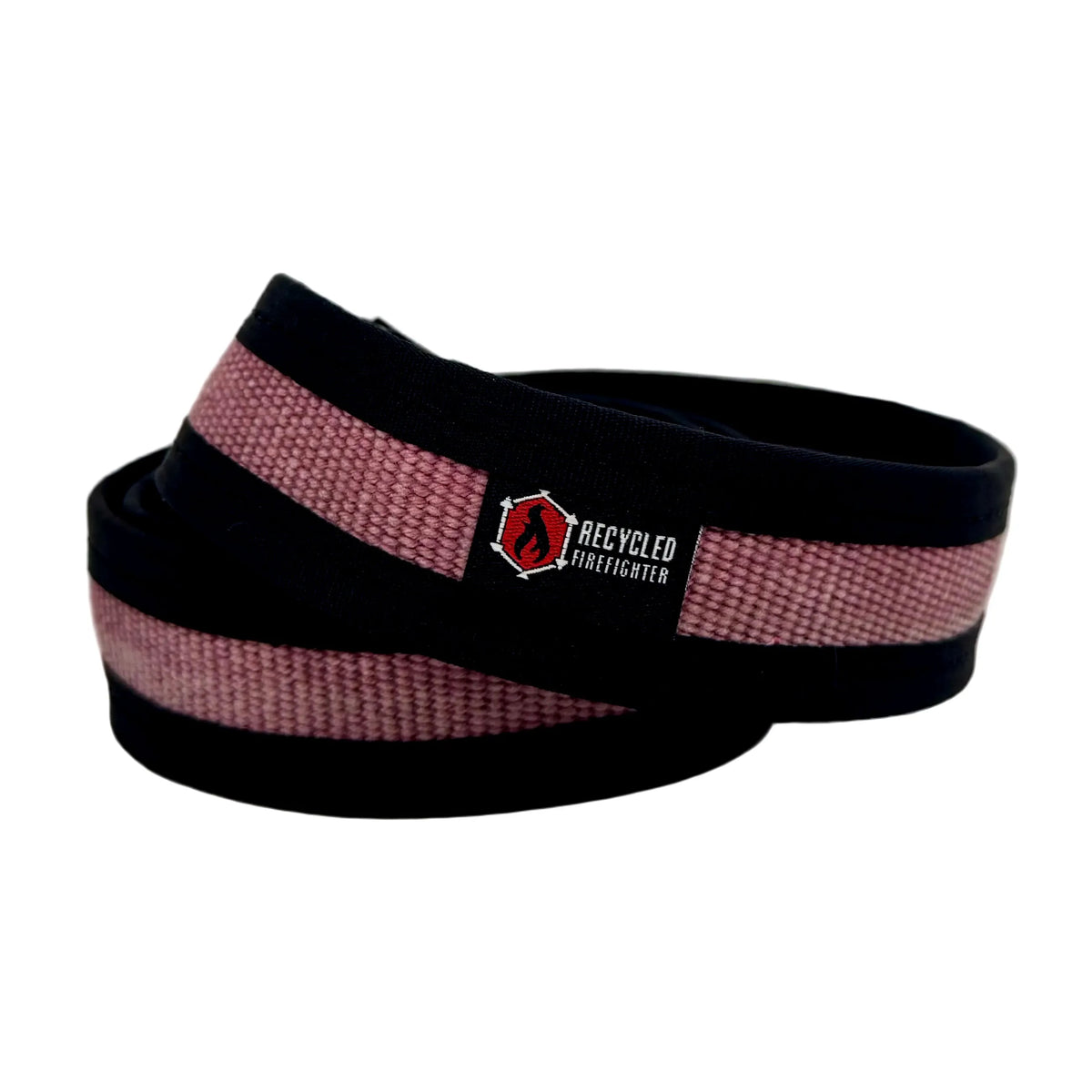 Vintage red Fire Hose EDC Belt coiled with a black edge and logo patch