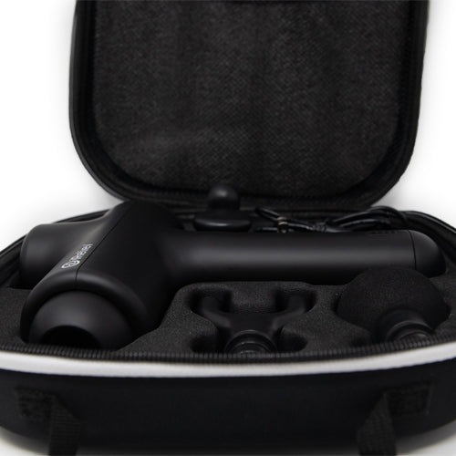 Close-up of the open carrying case with the massage gun and heads in fitted slots