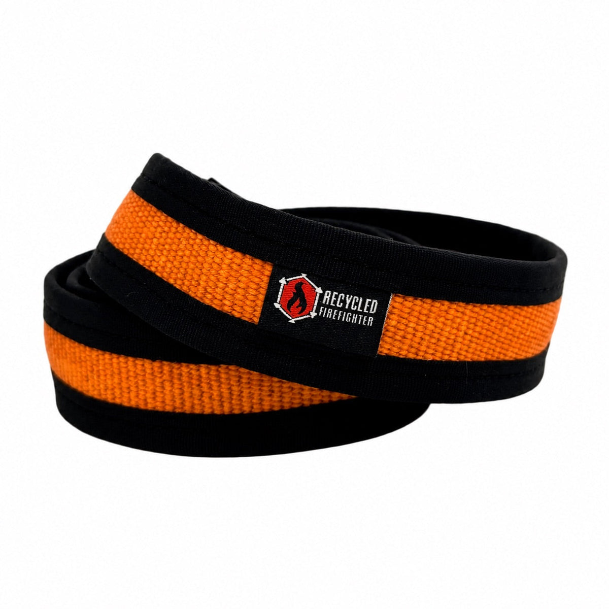 Orange Fire Hose EDC Belt coiled with black edging and a logo patch