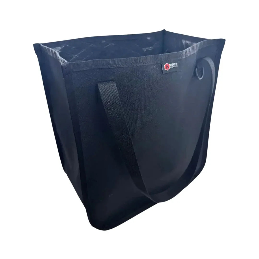 Black Tactical Tote with black handles and a small logo patch