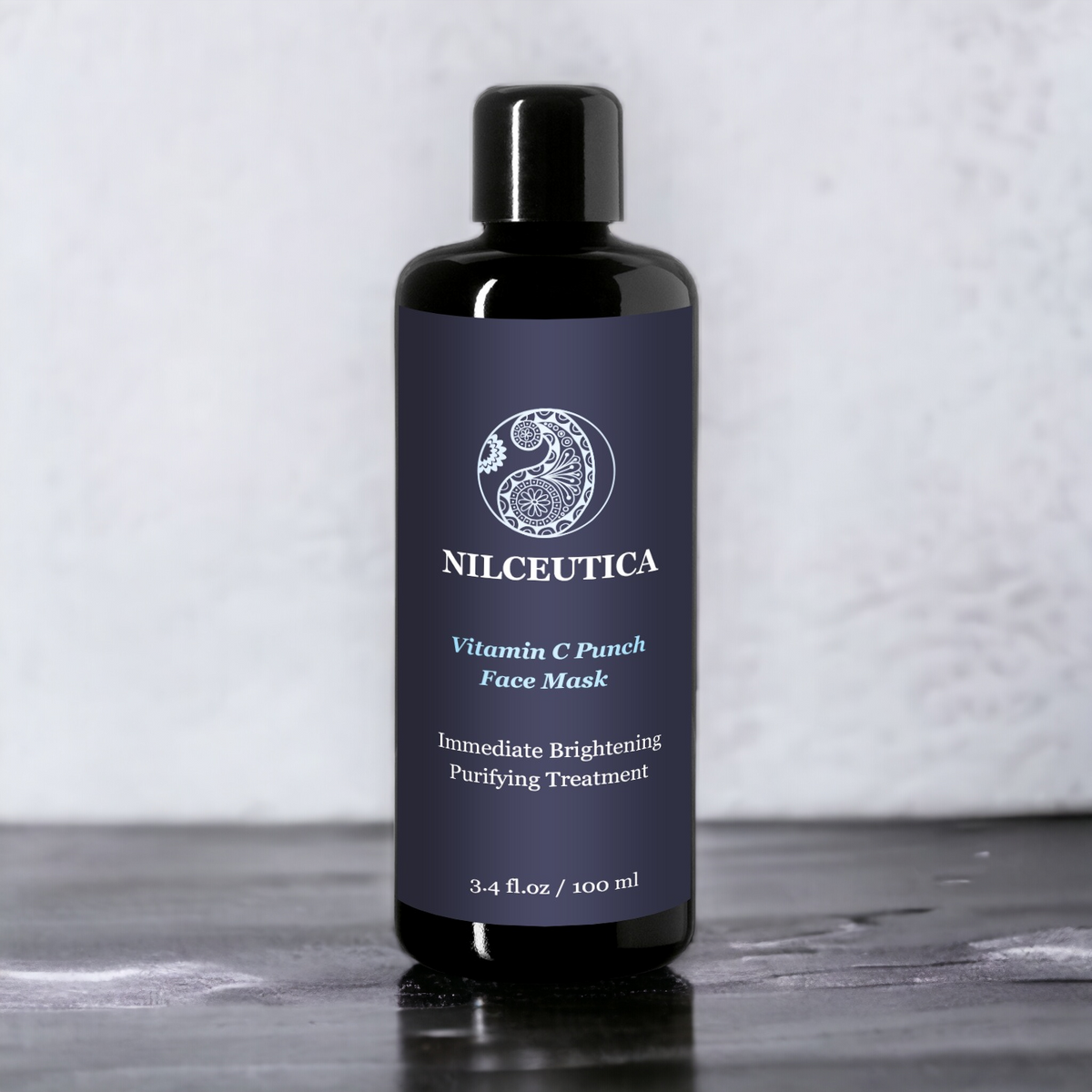 Tall dark NILCEUTICA bottle with a black cap on a gray surface