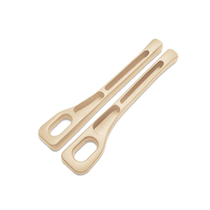 Pair of beige CHICAMOR SeatSlot car seat gap fillers on a white background
