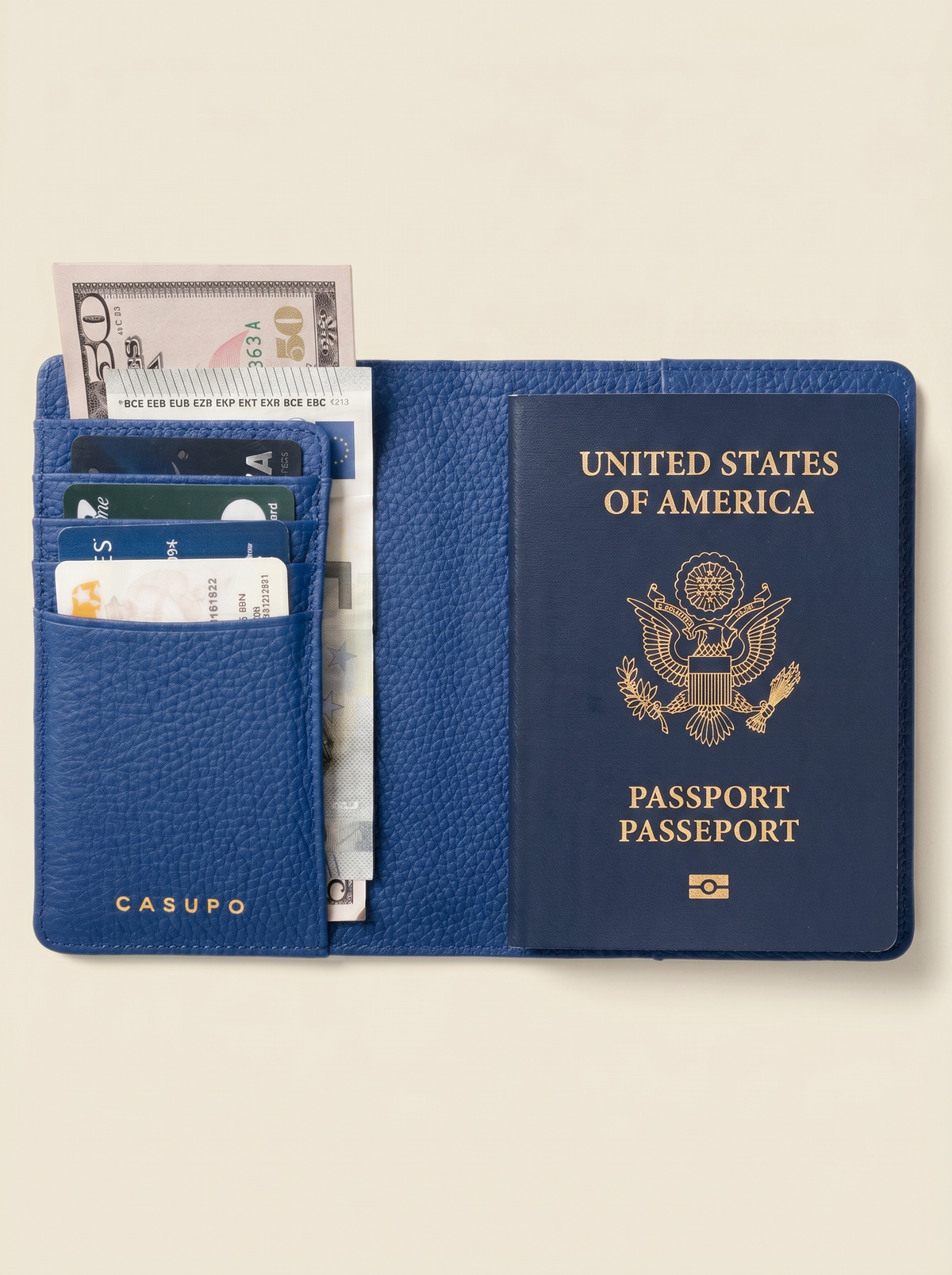 Open cobalt blue passport wallet holding a US passport, cards and banknotes