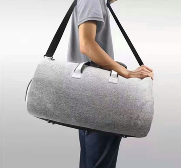 Man Holding Travel Bag