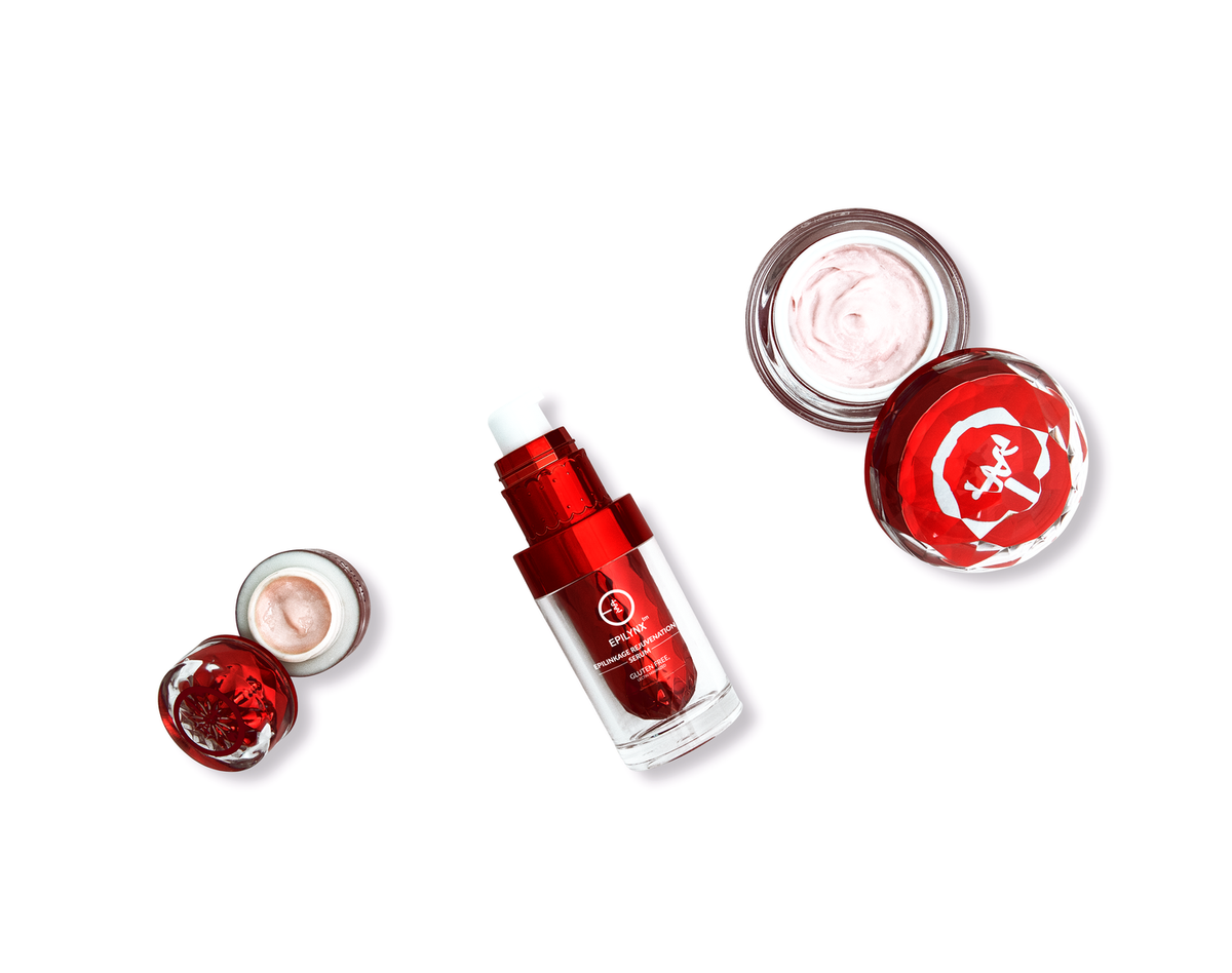 Top-down view of the red serum bottle with two small jars, one of them open