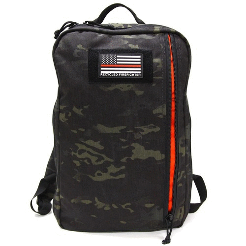 Recycled Firefighter 24 Hour Backpack in black multicam with a US flag patch and shoulder straps, angled view
